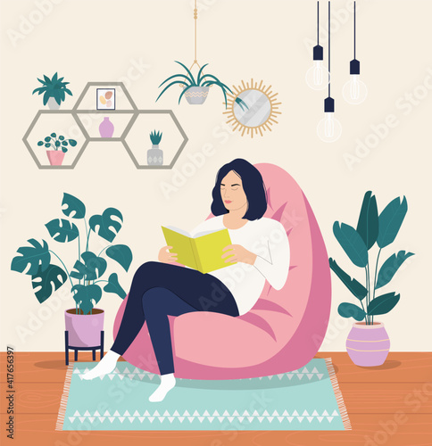 Young woman is relaxing on comfortable chair and reading book. Vector flat style cartoon illustration.