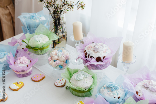 Beautiful Easter cakes on a decorated light table. A light holiday of Easter.