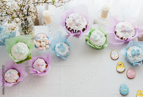 Beautiful Easter cakes on a decorated light table. A light holiday of Easter.