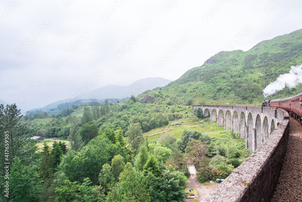 Jacobite Steam Train Locomotive passing Glenfinnan Viaduct