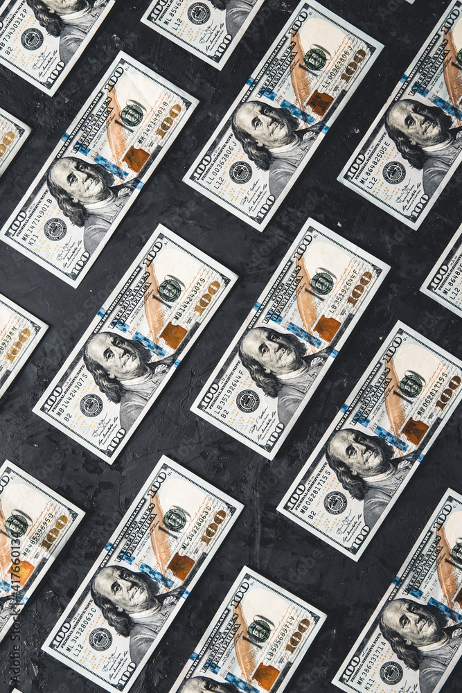 One hundred dollar bills are creatively laid out. Business concept, development perspective.