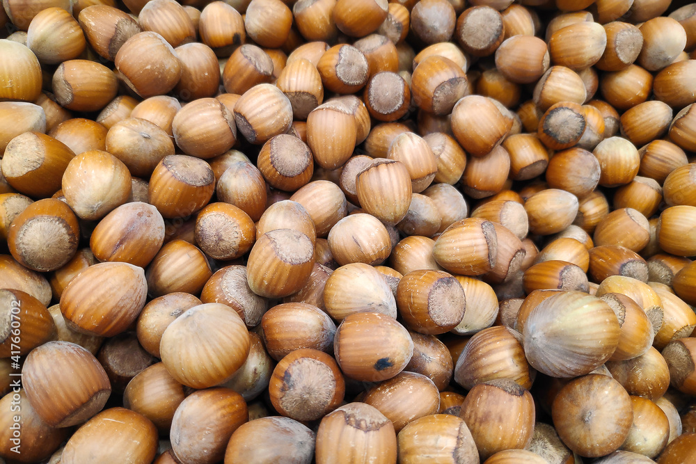 Close-up on a stack of hazelnuts on a market stall. Close-up on a stack of hazelnuts on a market stall.