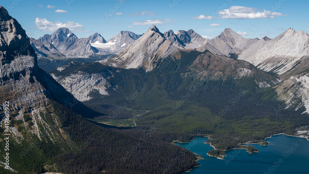 Panoramic view of Upper Kananaskis Lake and beautiful mountain scenery seen from Sarrail Ridge in Kananaskis Country, Alberta, Canada.