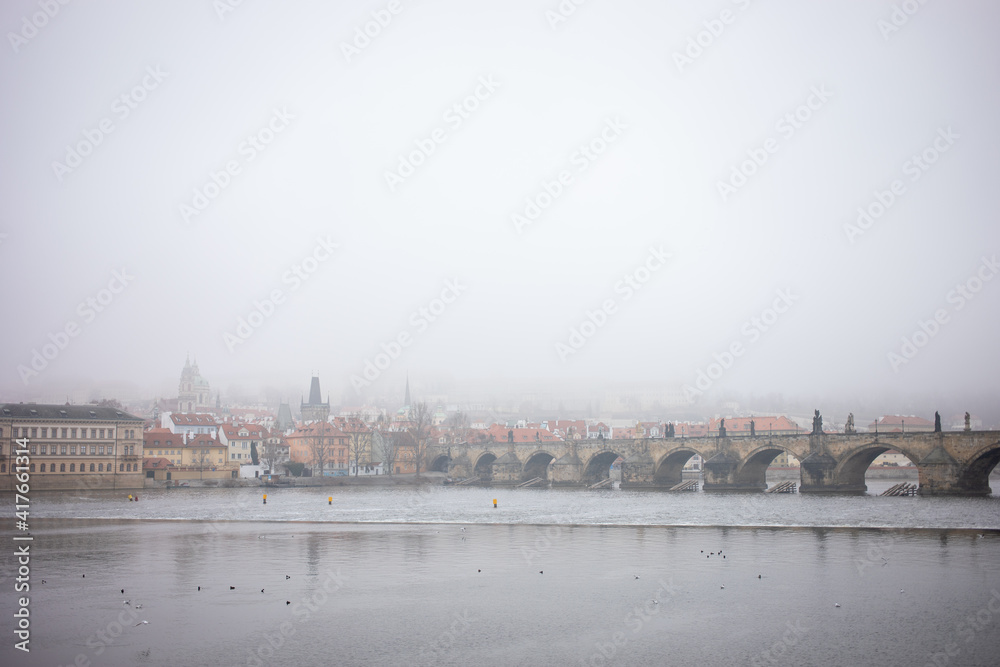 Fototapeta premium Charles bridge old town Prague hidden in the mist