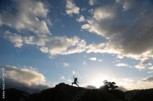 outdoors yoga meditation silhouette in the sky