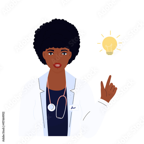 Female doctor. African American woman in a white gown. Hospital staff