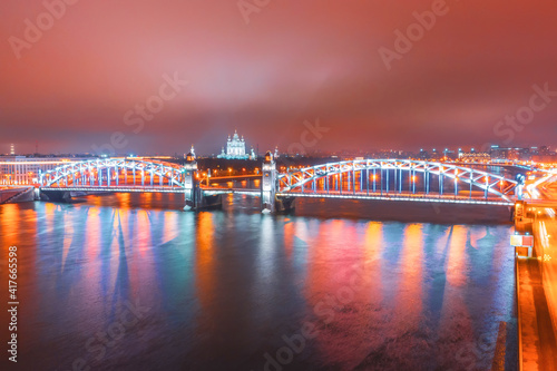 Saint Petersburg. Russia. Bolsheokhtinsky bridge in the night aerial view. Peter the Great bridge across the Neva.
