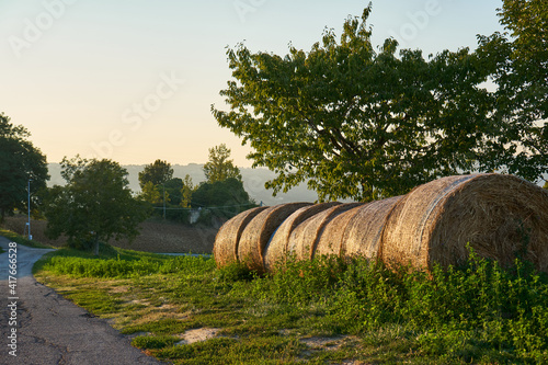 Hay bales in Italian village. Rural landscape.