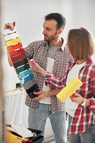 Two workpeople selecting the right interior paint photo