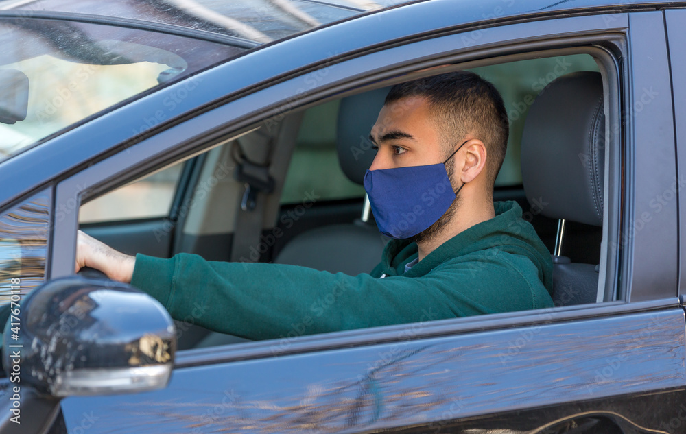 health protection, safety and pandemic concept,taxi driver on his car health protection, safety and pandemic concept,taxi driver on his car