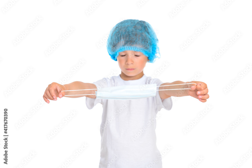 Medical protective mask in the hands of a boy Medical protective mask in the hands of a boy