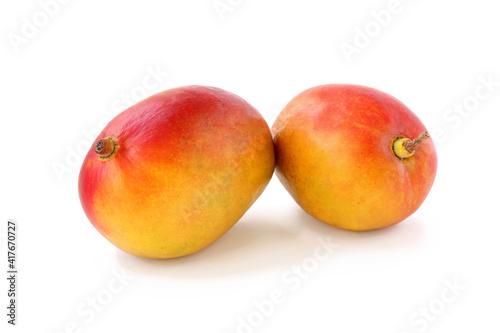 Two red - yellow mangoes isolated on white