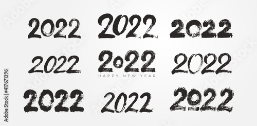Big Collection of 2022 Happy New Year typography logo brush strokes text design. 2022 number design template. Set of 2022 happy new year symbols. Freehand drawing. Vector illustration with black.
