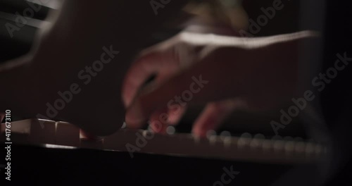 Close up of finger musician at the piano , The pianist playing  piano in the room ,classic piano.hobby