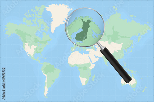Map of the world with a magnifying glass on a map of Finland.
