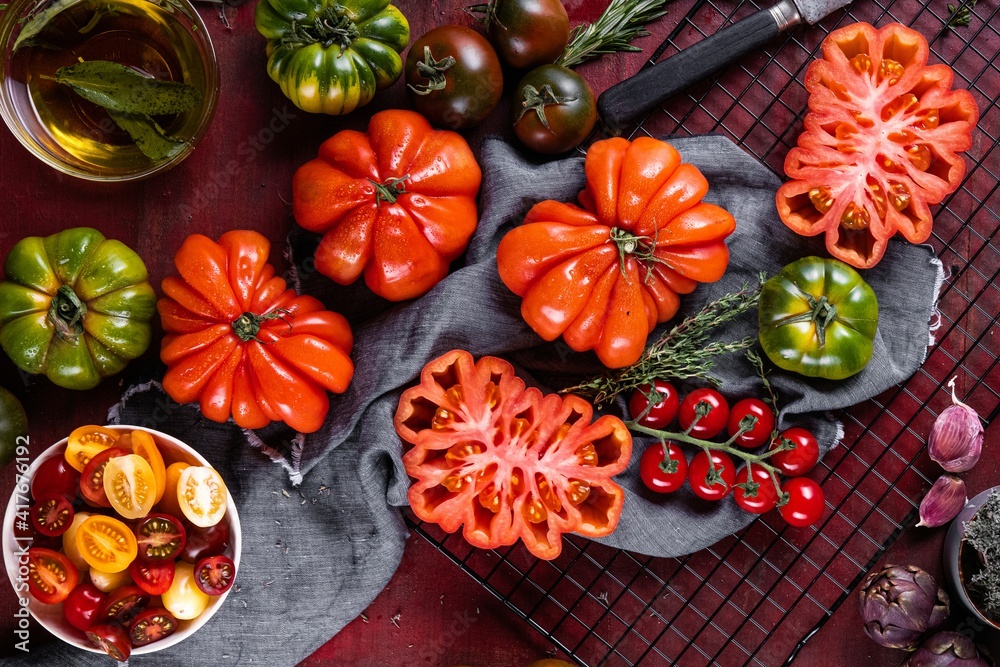Ox heart tomatoes, on rustic wood background Ox heart tomatoes, on rustic wood background