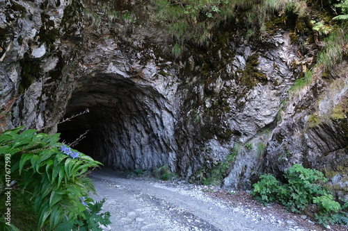 Galleria. Gallery carved into the rock. Dirt road tunnel. In the mountains of the Apuan Alps.