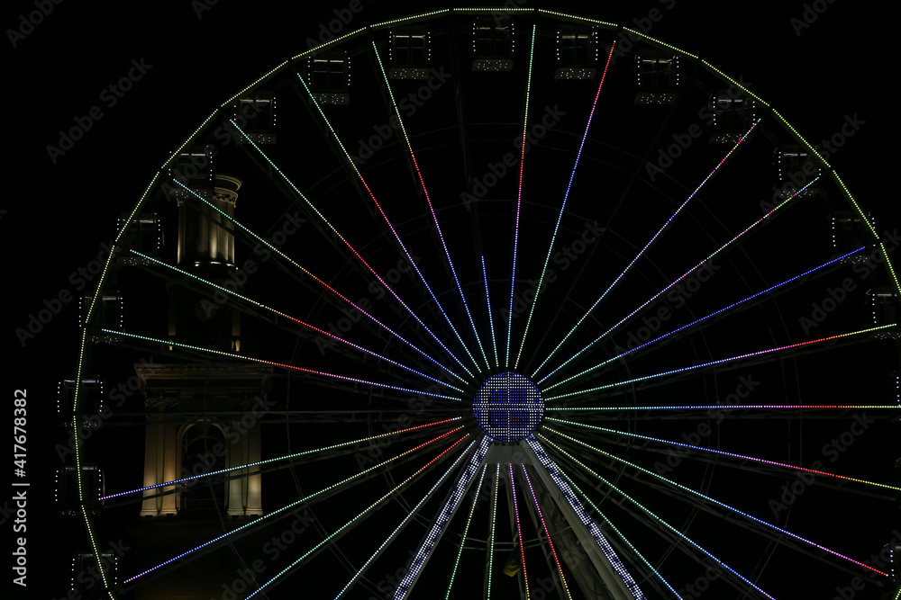 multicolored ferris wheel in the dark