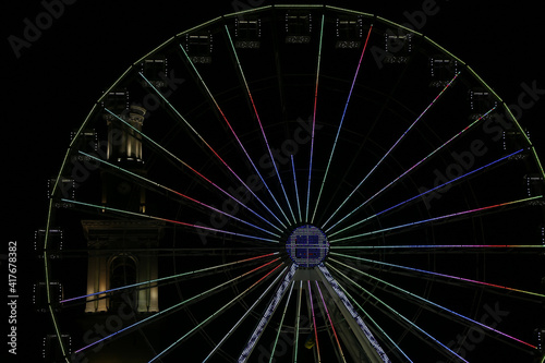 multicolored ferris wheel in the dark