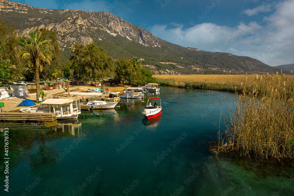 (Muğla - Turkey 05 February 2021) Travel boats in Akyaka, Kadın Azmağı Stream, one of the favorite places of tourism.