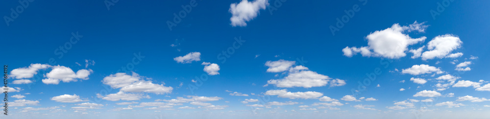 Panoramic fluffy cloud in the blue sky. Sky with cloud on a sunny day. Panoramic fluffy cloud in the blue sky. Sky with cloud on a sunny day.