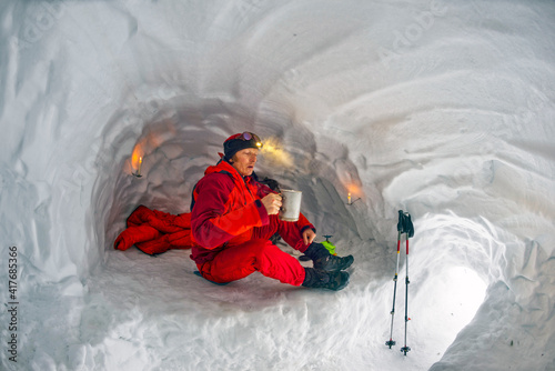 Climber in a snow cave.