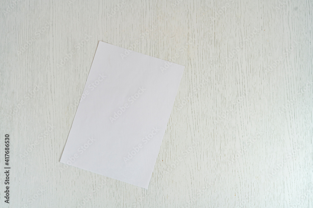 blank empty white paper sheet of a4 format on the table in office, mockup copy space blank empty white paper sheet of a4 format on the table in office, mockup copy space