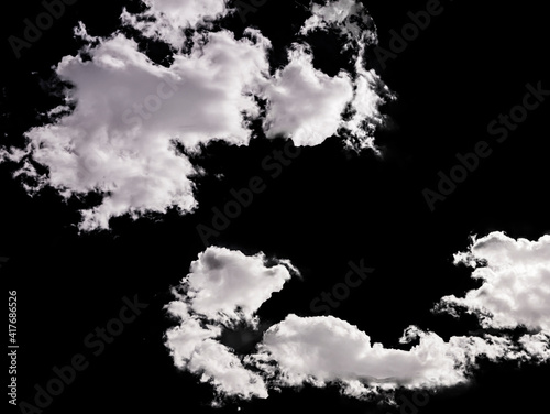 cloudy sky with some clouds in stormy weather isolated on black background