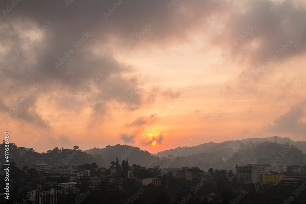 dramatic summer sunrise in Mines View Park  in the Summer Capital of the Philippines , Baguio City.