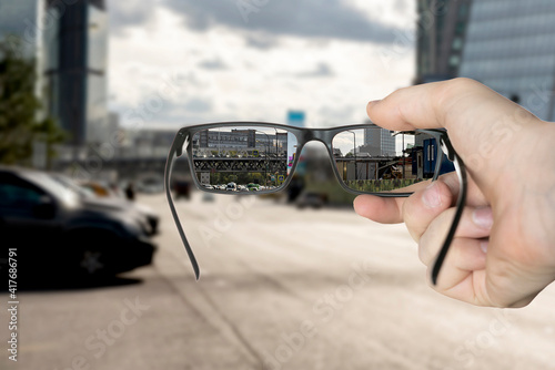 optical eyevision concept, frame of eyeglasses show focused image on the blurred background photo