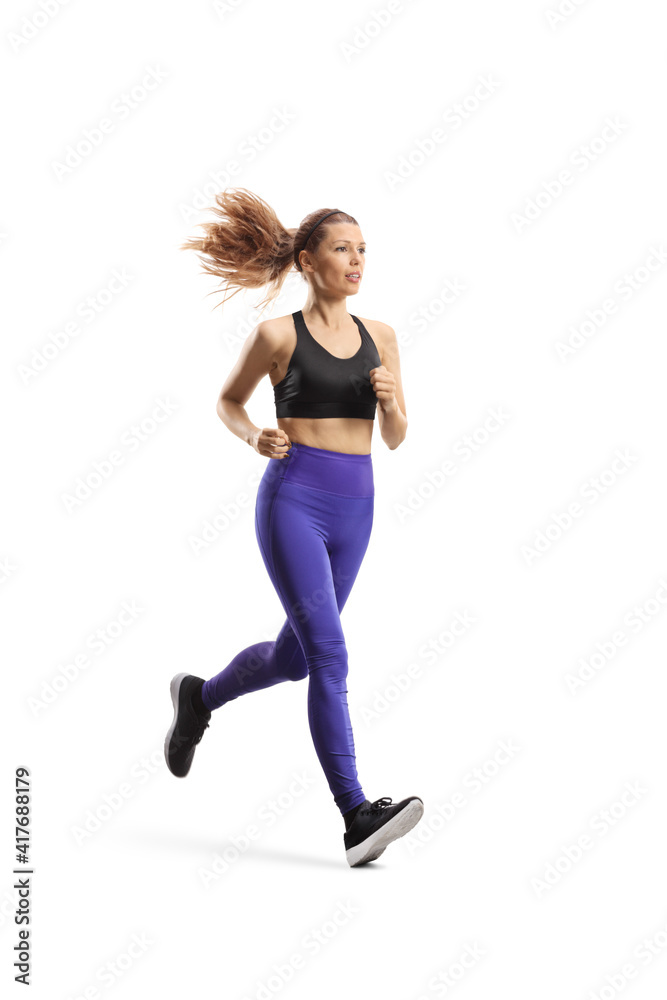 Full length shot of a slim young woman in sportswear running Full length shot of a slim young woman in sportswear running