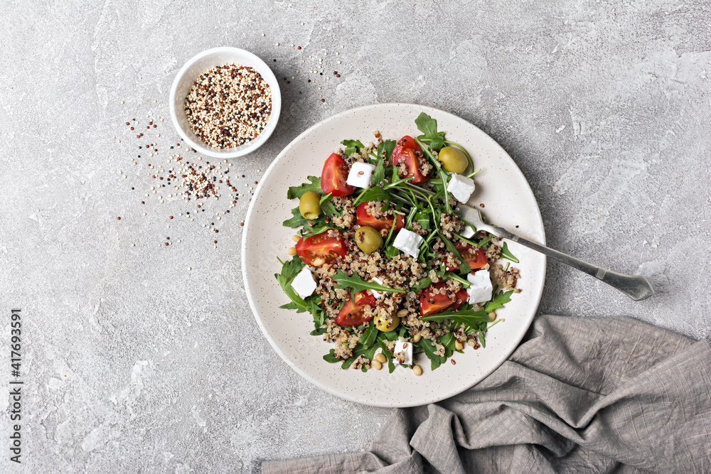 Healthy vegetarian salad with cooked chia seeds, fresh arugula, cherry tomatoes, soft cheese and olives Healthy vegetarian salad with cooked chia seeds, fresh arugula, cherry tomatoes, soft cheese and olives