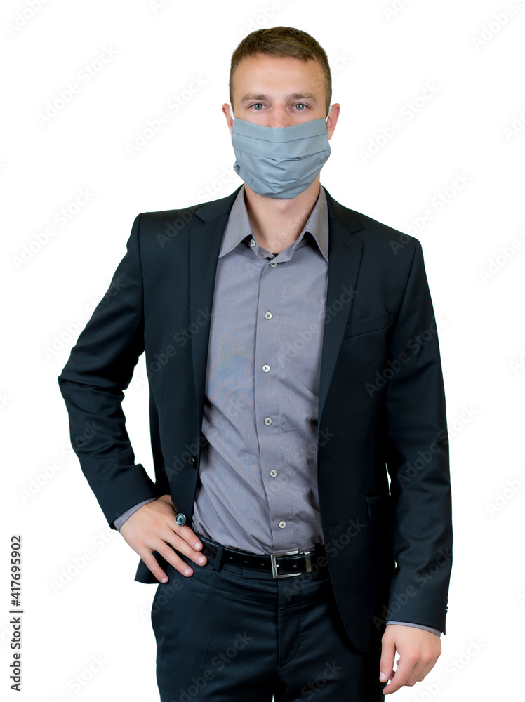 Modern young businessman with suit and face mask as protection against corona virus Modern young businessman with suit and face mask as protection against corona virus