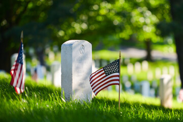 Headstones and National flags in Arlington National Cemetery - Circa Washington D.C. United States of America	