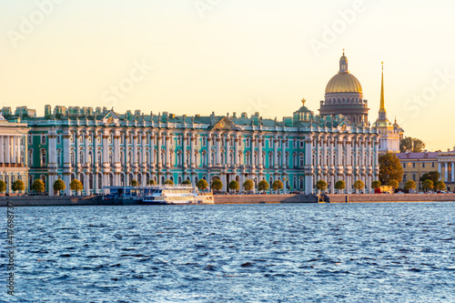 Saint Petersburg cityscape with St. Isaac's Cathedral dome and Hermitage museum at sunset, Russia photo
