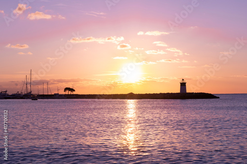 Morning view of the lighthouse and yacht port. Mediterranean sea of french riviera during sunrise. High quality photo