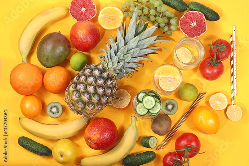 Fototapeta Naklejka Na Ścianę i Meble -  Detox diet and weight loss concept. Fruit drink and ingredients, summer tropical fruits and cocktails on a blue table, top view, healthy and natural food, source of vitamin C,