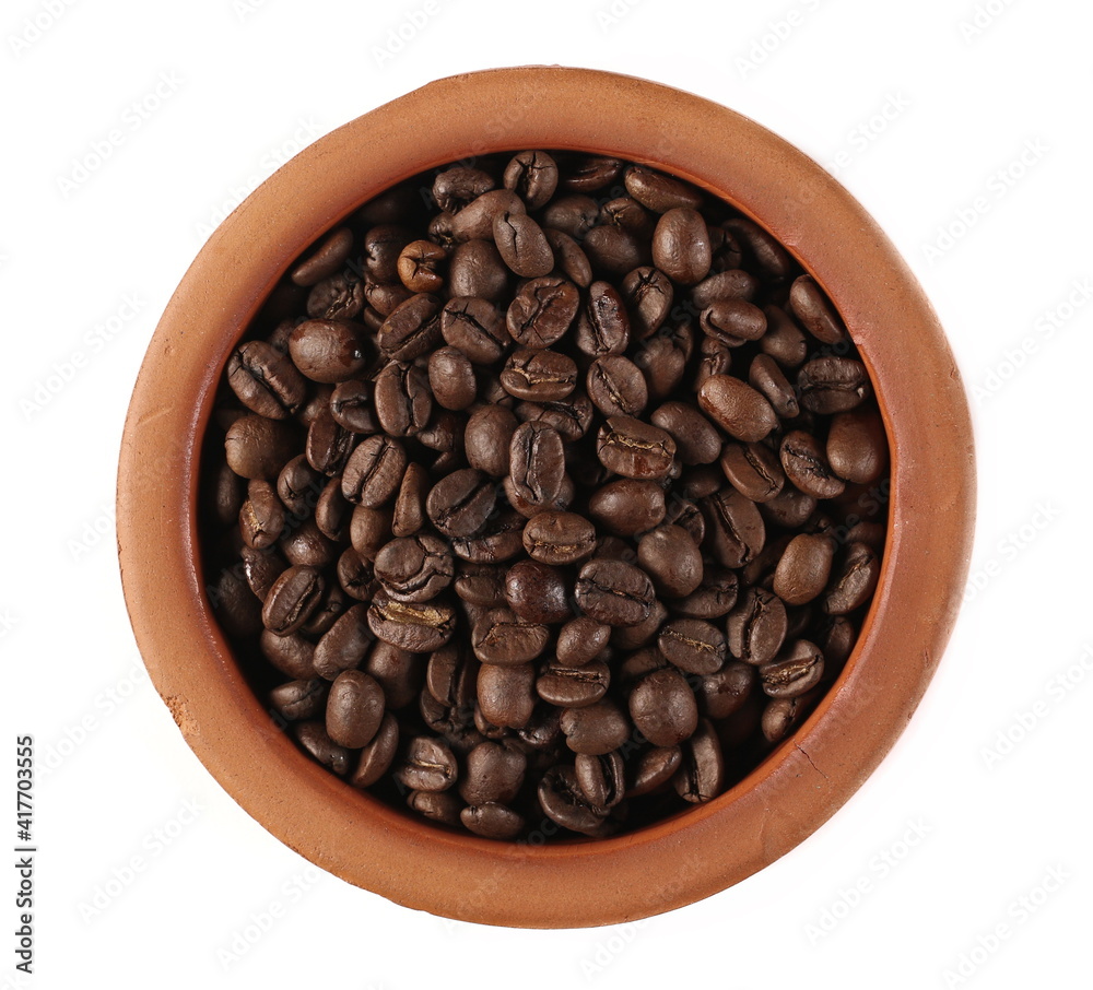 Coffee beans for espresso in clay pot isolated on white background and texture, top view Coffee beans for espresso in clay pot isolated on white background and texture, top view