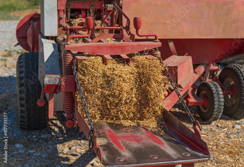 red hay machine in summer