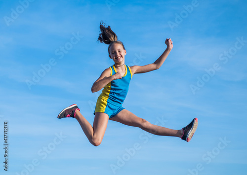Young and free. future of sport. outdoor activity. workout in morning. healthy child jumping outdoor. fitness kid wear sportswear. full of energy. teenage girl feel freedom. happy childhood