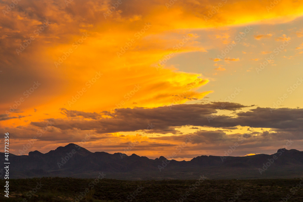 USA, Arizona, Santa Cruz County. Santa Rita Mountains silhouette at sunset.