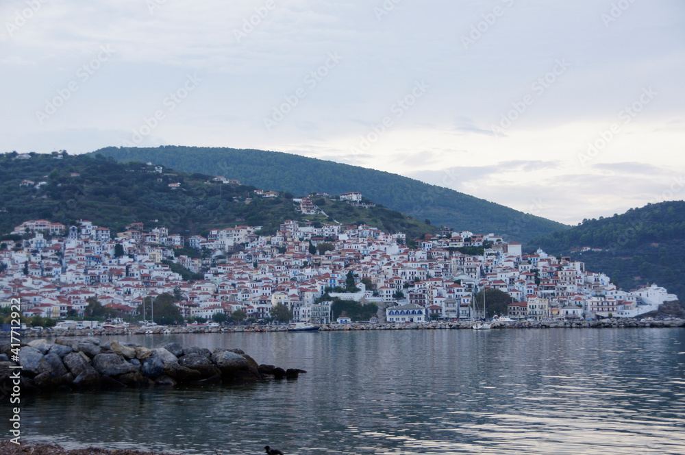 A bay view of Skopelos town in twilight. Skopelos, Greece