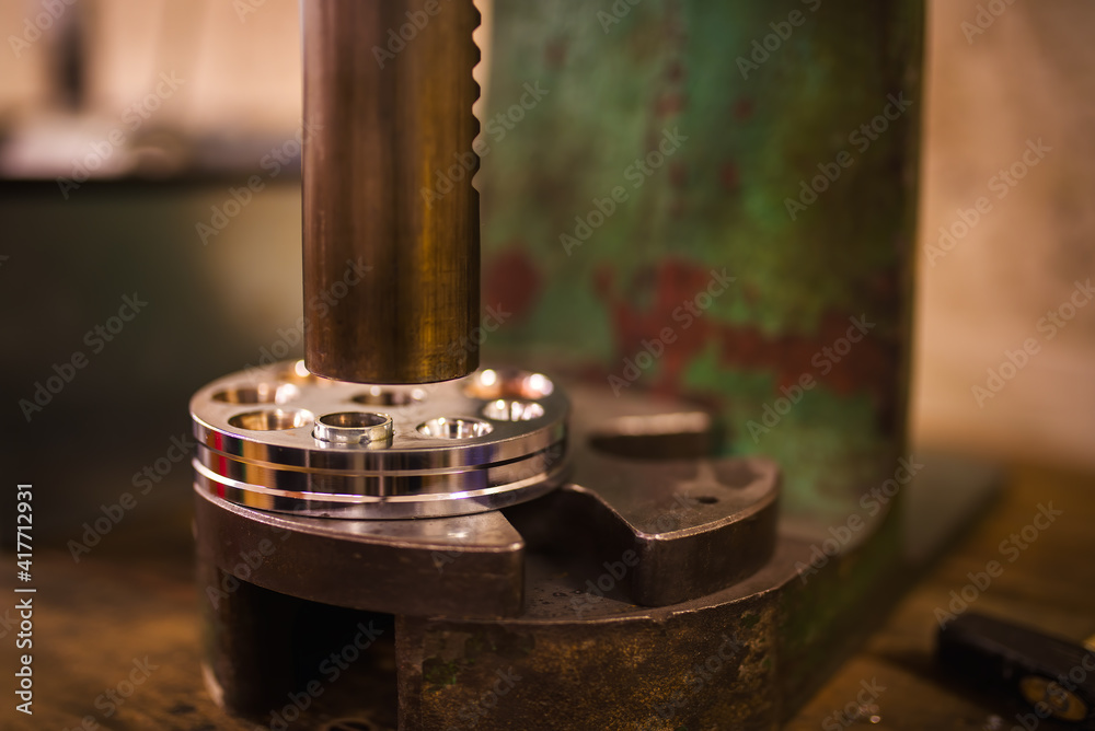 Detail of six spline ring stretcher and reducer in a goldsmith's workshop.