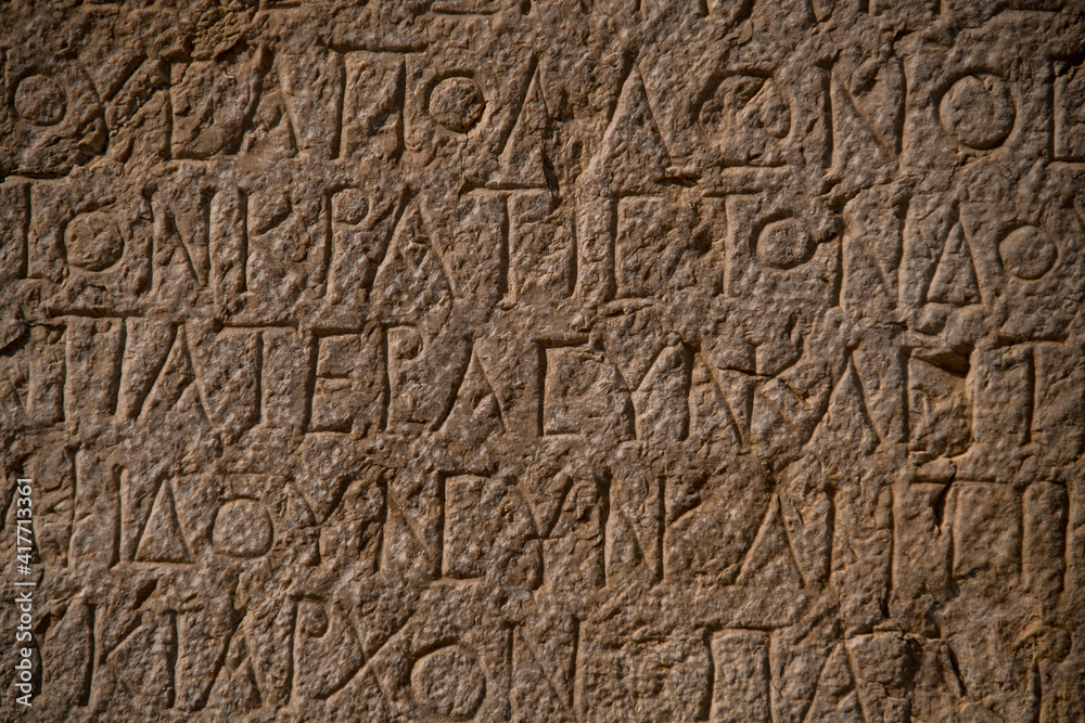 beautiful inscriptions containing curious holes from ruins of Patara