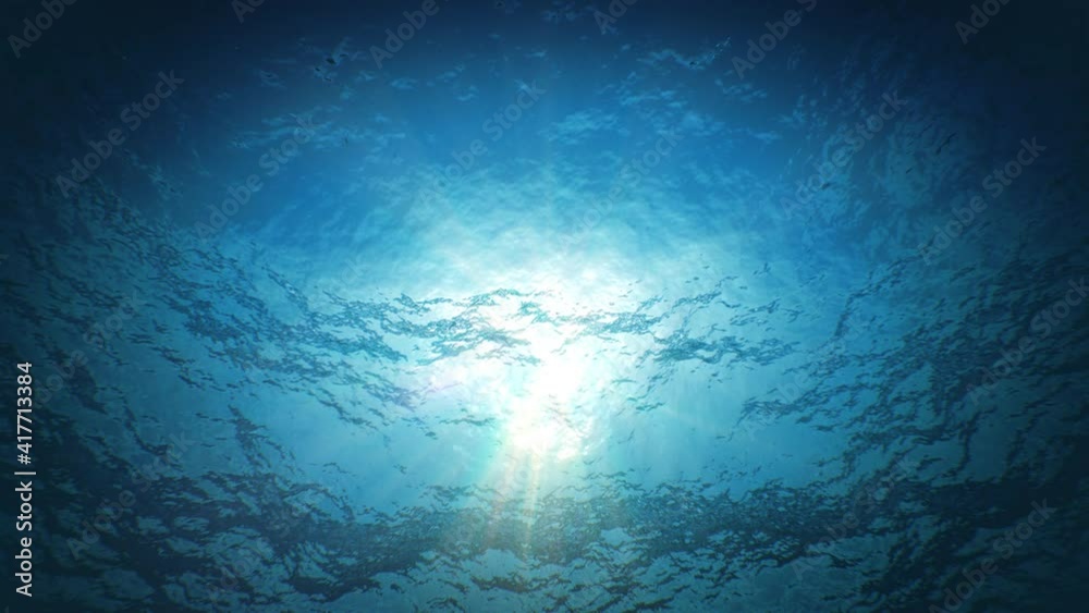 Beautiful Underwater Sun Light Beams Shining Through the Deep Blue Clear Water Seamless. Loop 3d Animation of Waving Water Surface from the Deep. 4k Ultra HD 3840x2160.