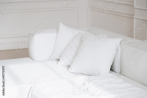 White couch with pillows
