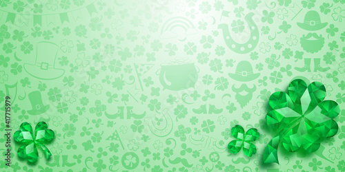 Background on St. Patrick's Day made of crystal clover leaves and other symbols in light green colors
