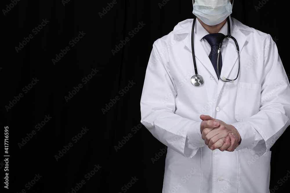 Doctor with stethoscope on black background Doctor with stethoscope on black background