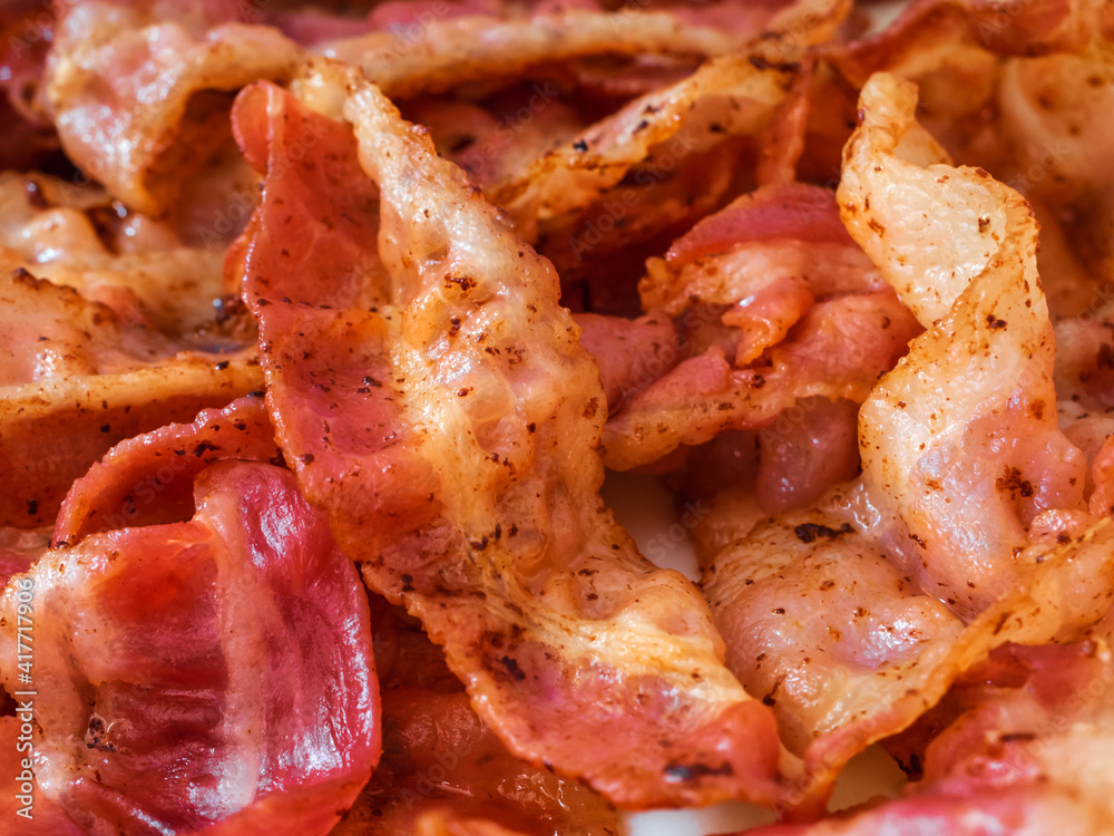 slices of fried bacon close up slices of fried bacon close up