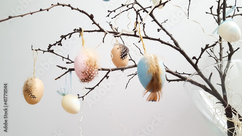 Canvas Print Easter dekorative eggs on tree branches.